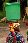 woman carrying a bucket on her head