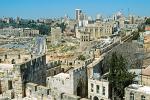 the old city walls, modern Jerusalem in the distance