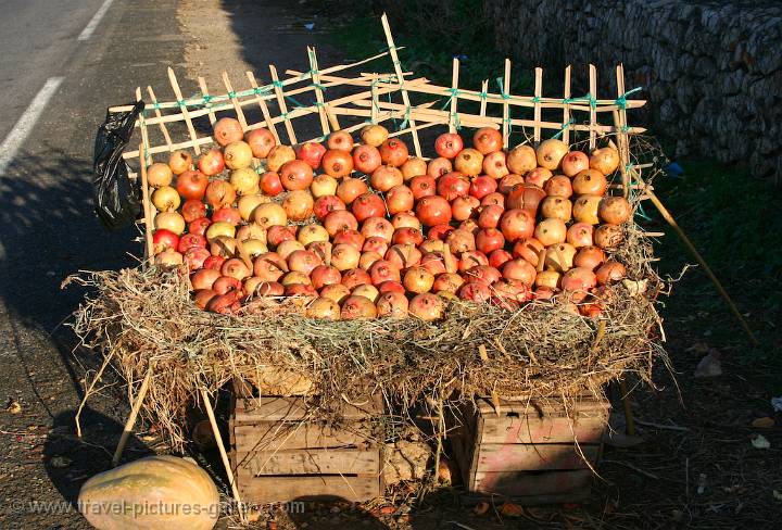 pommegranates at a roadside stall