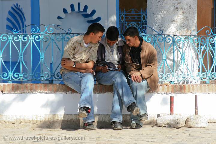 three men in the shade