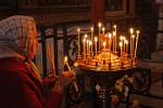 burning a candle at the Cathedral of St. Sophia, Novgorod Kremlin
