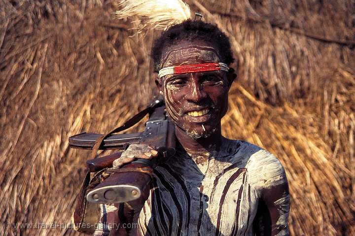 Omo Valley, Dus village, Karo tribe man and his gun