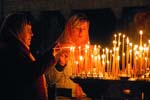 women burning candles,  Caves Monastery, Kyiv (Kiev)