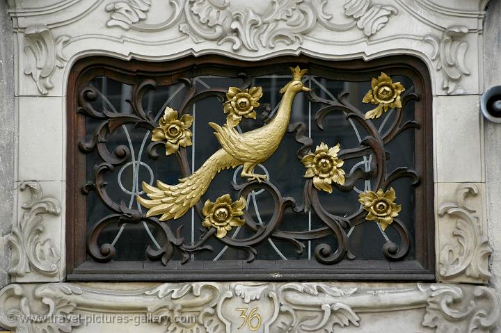 wrought iron peacock at a house entrance