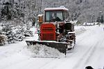 snow tractor clearing the road