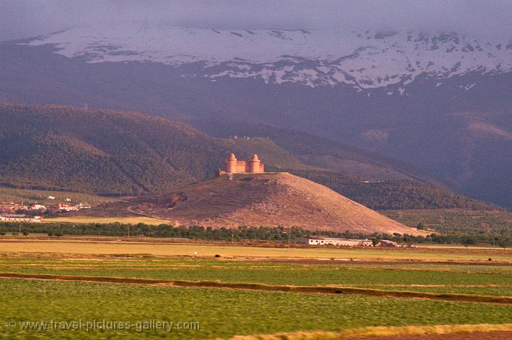 medieval castle at the foot of the mountains